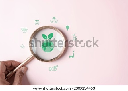 Magnifier focus to global earth decrease CO2 or carbon dioxide emission, carbon footprint and carbon credit to limit global from climate change, Earth for develop green energy
