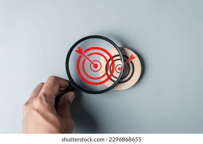 Magnifier focus to target solution icon to Changing goals and solving business problems.