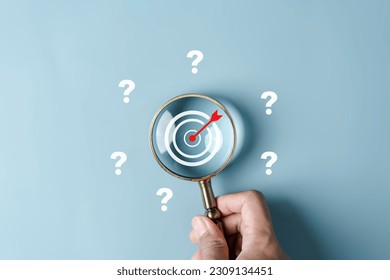 Magnifier focus to target solution target which among question icon, successful business and thinking solution strategy concept.