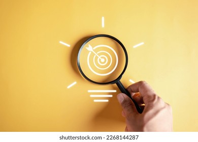 Magnifier glass focus to target objective with idea creative light bulb icon. planning development leadership and customer target group concept.	
 - Powered by Shutterstock