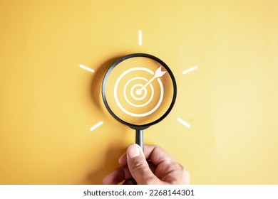 Magnifier glass focus to target objective with idea creative light bulb icon. planning development leadership and customer target group concept.	 - Shutterstock ID 2268144301