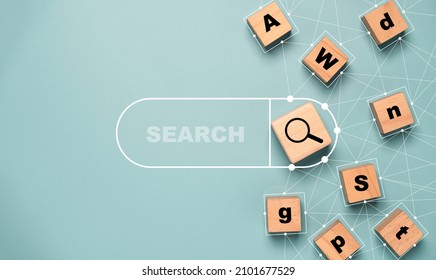 Magnifier glass icon print on wooden block with connection link to English alphabet and search bar for search engine optimisation or SEO concept. 