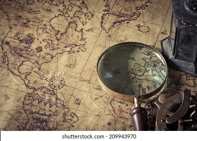 Magnifier with lantern with compass on the  old map  ,picture style vintage - Shutterstock ID 209943970