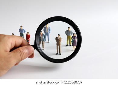 Magnifier And Miniature People.