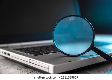 Magnifier On A Laptop. Web Search Concept