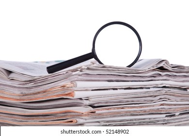 Magnify glass over a stack of newspaper to find fresh information (isolated on white)
