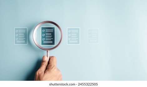 magnifying, document, search, innovation, list, check, communication, navigation, laboratory, research. A hand holding a magnifying glass with a series of file. Concept of examining or a task list. - Powered by Shutterstock