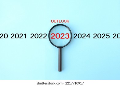 Magnifying glass and 2023 with OUTLOOK word - Shutterstock ID 2217710917