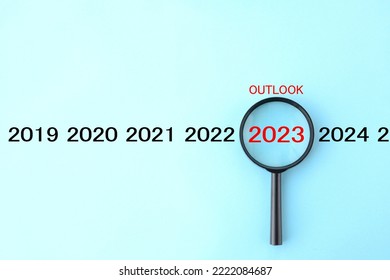 Magnifying glass and 2023 with OUTLOOK word - Shutterstock ID 2222084687