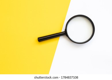 Magnifying Glass Against Colorful Background Flat Lay Minimal Creative Concept.