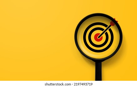 Magnifying glass with aiming dart board icon with copy space on yellow background - Shutterstock ID 2197493719