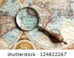 Magnifying glass and ancient old map