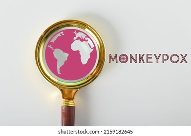 Magnifying glass and earth with phrase MONKEYPOX. Health and medical concept