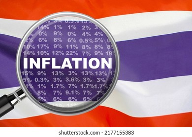 Magnifying glass focused on the word inflation on Thailand flag background. Hike interest rate. Inflation income crisis. Inflation, tax, cash flow and another financial concept in Thailand