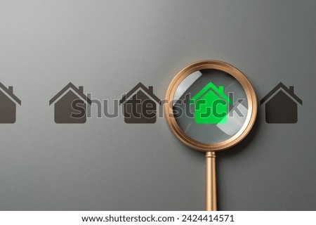 Magnifying glass and green house. High energy efficiency. Green technologies in construction. Ecological housing. Self-sufficient, autonomous and zero carbon emissions. Minimal impact on environment.