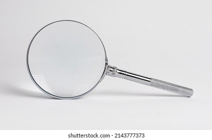 Magnifying glass. Information search, data analysis. Education concept. Thorough study of documents, contracts, reports. High quality photo