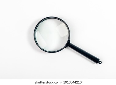 Magnifying glass or lens on white, top view. - Shutterstock ID 1913344210
