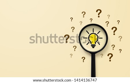 Magnifying glass with light bulb icon and question mark symbol. Concept creative idea and innovation