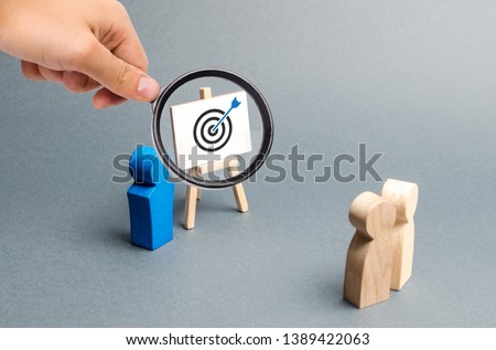 Magnifying glass is looking at leader explains employee tactics of advertising targeting. Training, briefing. Search strategies for effective advertising campaigns, customer reach. Business processes