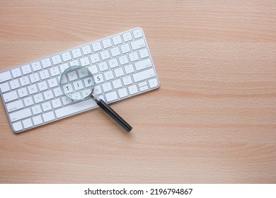 A Magnifying Glass Magnifies The Word TIPS On The Computer Keyboard