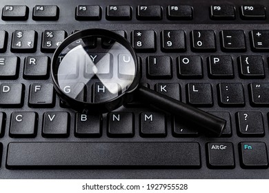 https www shutterstock com image photo magnifying glass on black computer keyboard 1927955528