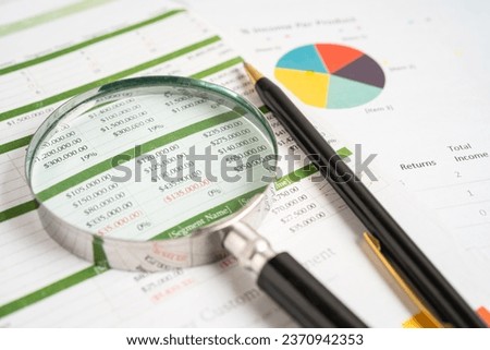 Magnifying glass on graph paper. Financial development, Banking Account, Statistics, Investment Analytic research data economy, Business concept.