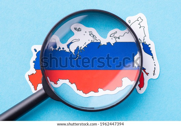 Magnifying glass on the map of Russia. Studying\
Russian Federation, interesting facts, event, dates connected with\
Russia