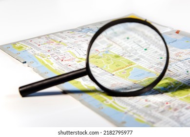 Magnifying Glass Over A Map Of New York City, Pointing To Central Park. White Background.