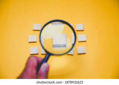 Magnifying Glass over a wooden block. Search concept. Copy Space. Selected Focus - Shutterstock ID 1878932623