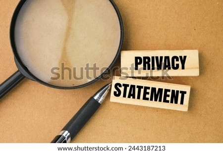 magnifying glass, pen and stick with letters or words privacy statement. the concept of privacy