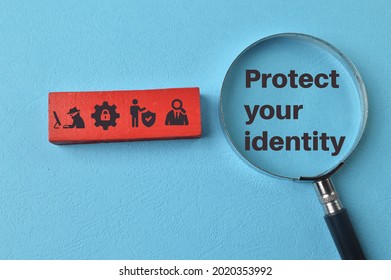 Magnifying Glass With Phrase PROTECT YOUR IDENTITY And Data Protection Symbols