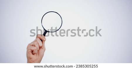 Magnifying glass searching for deals, hand and investigation, search or study with mockup space on white background. Knowledge, source and spy person with analysis, research and reading with problem