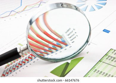 Magnifying Glass And The Working Paper With A Diagram