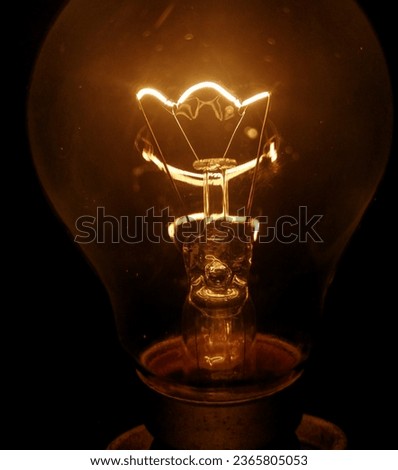 Magnifying View of Incandescent Light Bulb.Explore the intricate beauty of an incandescent light bulb like never before with this captivating magnified view.