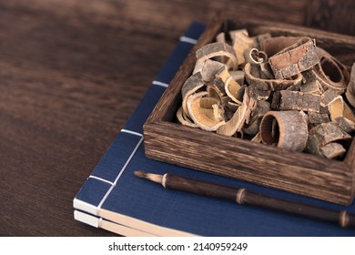 Magnolia Officinalis And Albizia Bark In A Wooden Box