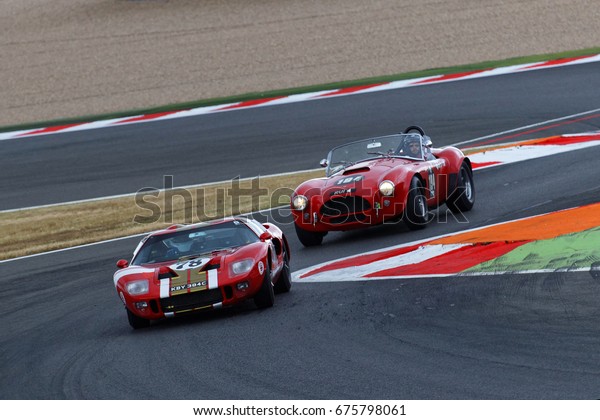 MAGNY-COURS,\
FRANCE, June 30, 2017 : Ford GT40 and AC Cobra at the chicane. The\
First French Historic Grand Prix takes place in Magny-Cours with a\
lot of ancient sports and Formula one\
cars.