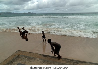 MAHE, SEYCHELLES - AUGUST 13 2019 - Young Creole People Having Fun On The Beach. With A Population Of Roughly 94,367, It Has The Smallest Population Of Any Sovereign African Country