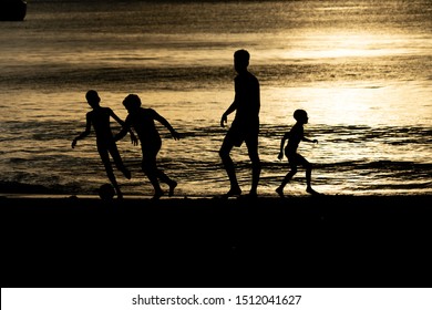 MAHE, SEYCHELLES - AUGUST 13 2019 - Young Creole People Having Fun On The Beach. With A Population Of Roughly 94,367, It Has The Smallest Population Of Any Sovereign African Country