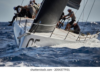 Mahon, Spain - October 30, 2021: The Sled Sail Team Working Hard During The Race In The 52 SUPER SERIES Menorca Sailing Week.