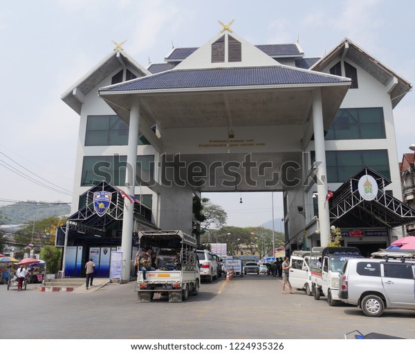 MAI SAI, THAILAND—MARCH 2018: \
Cars slow down while crossing the border from Mai Sai to\
Myanmar