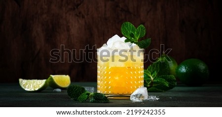 Mai Tai cocktail, refreshing drink with white rum, liqueur, sugar syrup, lime juice, mint and crushed ice. Dark background, bar tools, copy space