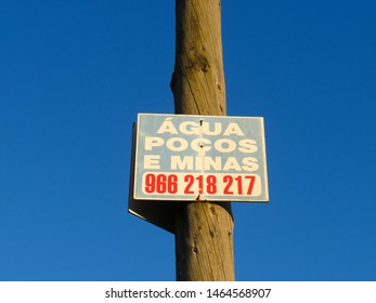 Maia, Porto, Portugal - June 29, 2019: Signboard Of A Mineral Water Vendor And Its Phone Number On The Roadside In Daylight.