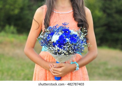 Maid Of Honor Holding Brides Blue Bouquet