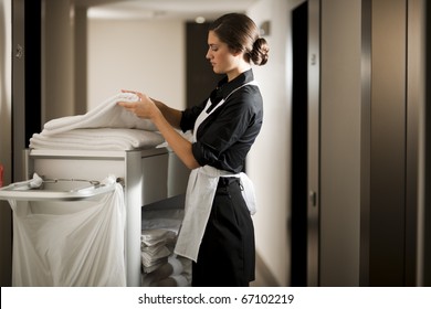 Maid with housekeeping cart