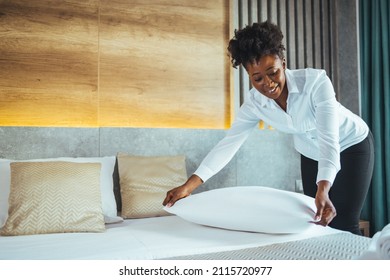 Maid Working Making The Bed At A Hotel. Housekeeper Making The Bed At A Hotel. Female Hand Set Up White Bed Sheet In Bedroom. Chambermaid Making Bed