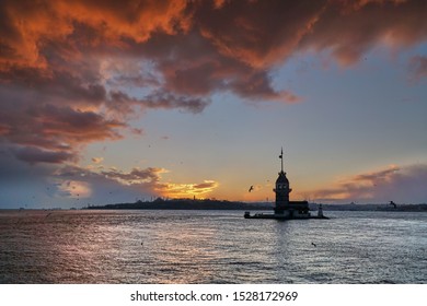 Maiden Tower (Kiz Kulesi) And Silhouette Of Historical Mosques Of Istanbul At The Sunset, In Winter, Turkey