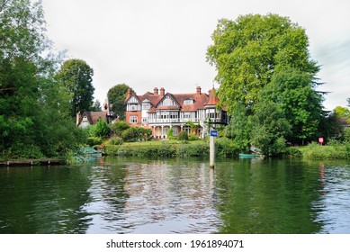 Maidenhead, UK - August 21, 2019 - Castle-like building in a greenery on the River Themes near Maidenhead, Berkshire, England