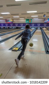 MAIDENHEAD, UK - February 3, 2018: A Boy Bowls A Ball Down A Ten Pin Bowling Alley.