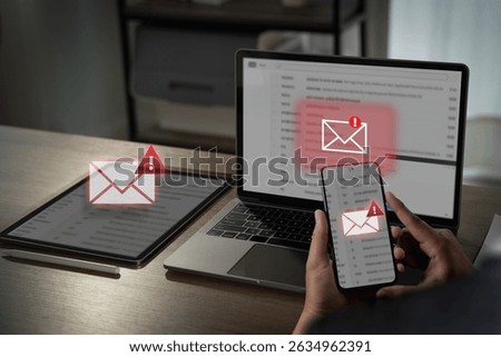 A mail alert, email hack sms spam image shows person checking email alerts multiple devices, indicating potential security or spam issues