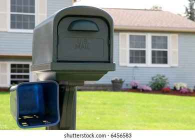 mail box in close up, background house